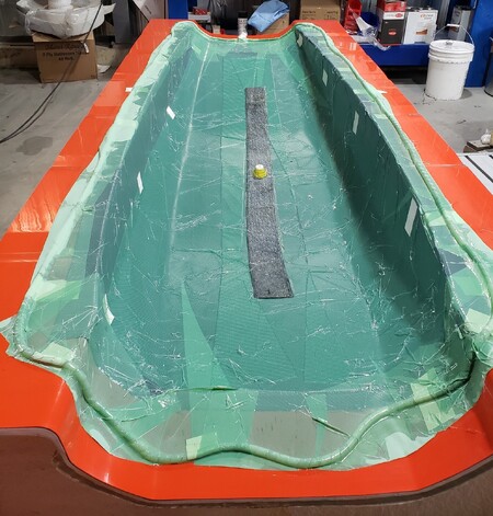 Component made of injected carbon using the RTM Light process per bag