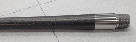Stainless steel barrel coated with carbon